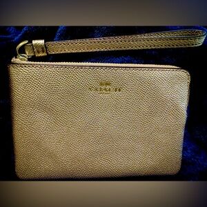 Coach Gold Wristlet with Textured Leather and Minimalist Design